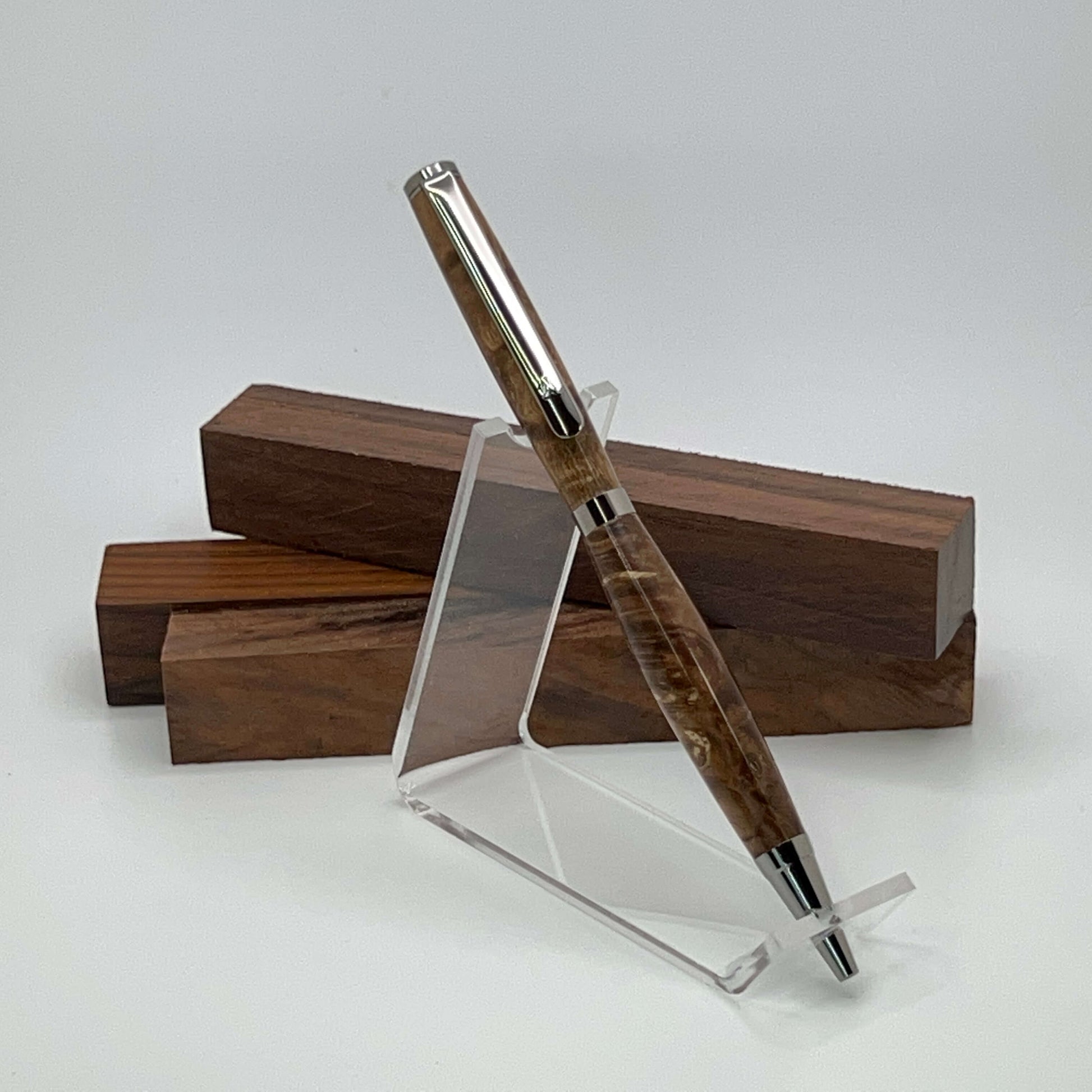 Handcrafted pen with Box Elder Burl wood dyed brown and black titanium hardware