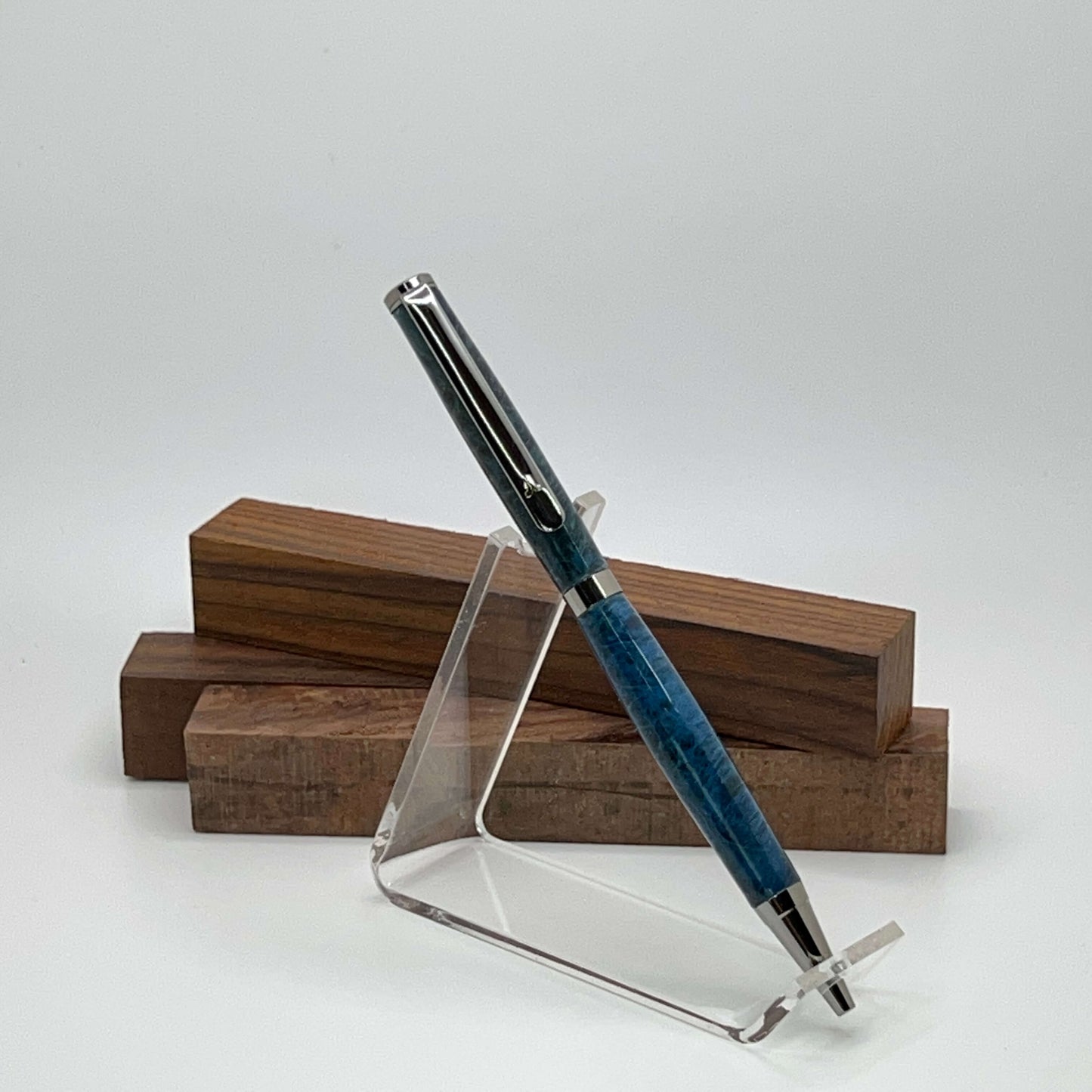 Handcrafted pen with Box Elder Burl wood dyed blue and black titanium hardware