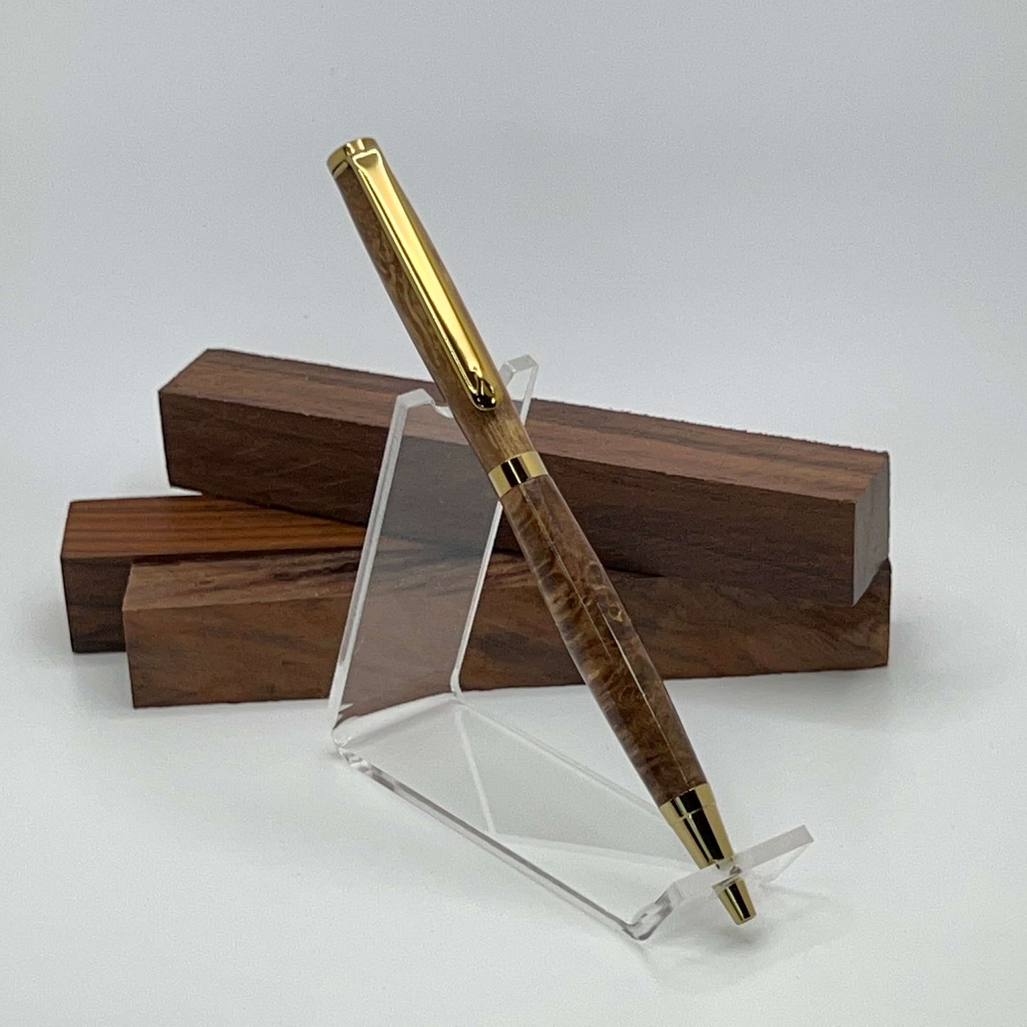 Handcrafted pen with Box Elder Burl wood dyed brown and gold titanium hardware