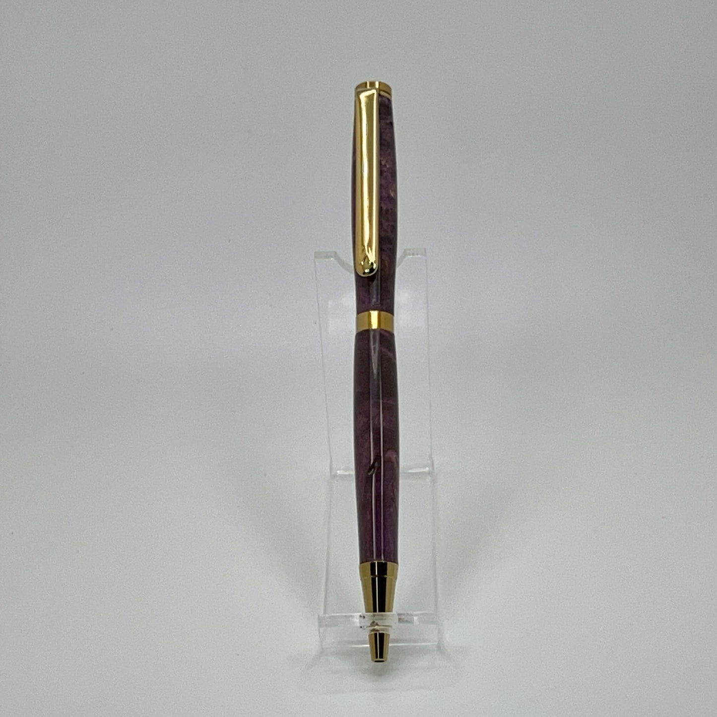 Front view of handcrafted pen with Box Elder Burl wood dyed purple