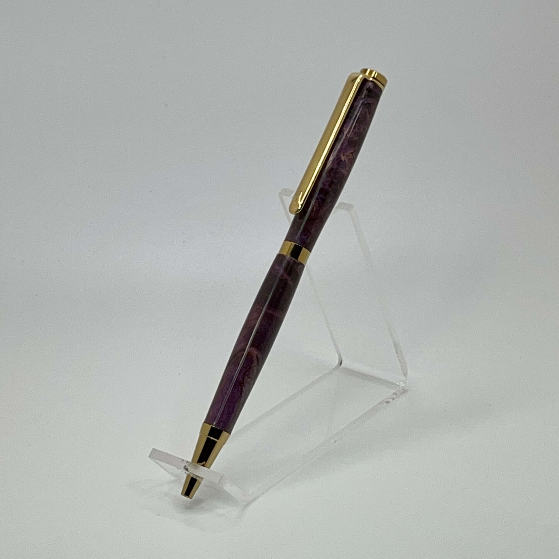 Left side view of handcrafted pen with Box Elder Burl wood dyed purple