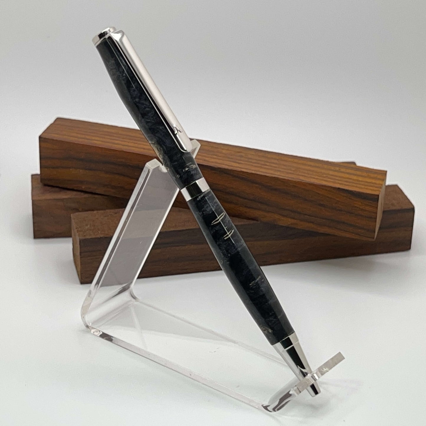 Handcrafted pen with Box Elder Burl wood dyed black and rhodium hardware