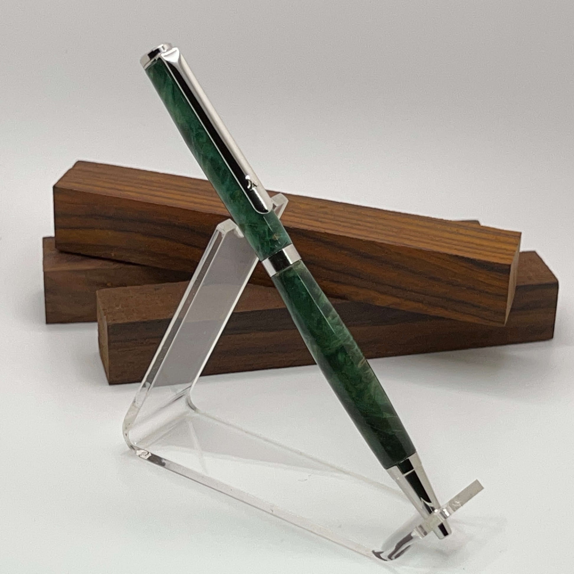 Handcrafted pen with Box Elder Burl wood dyed green and rhodium hardware