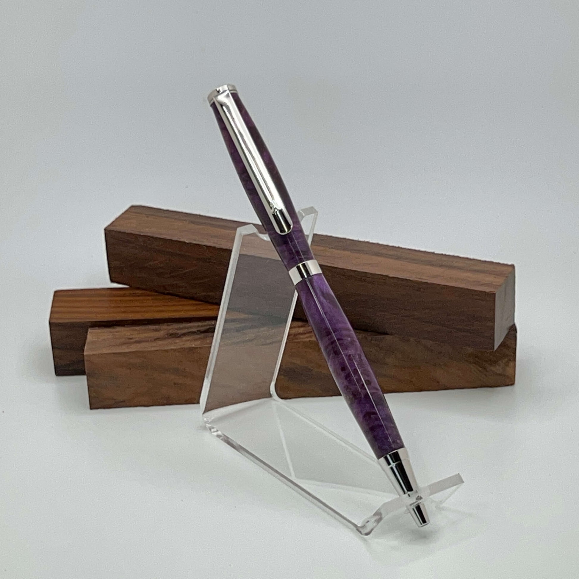 Handcrafted pen with Box Elder Burl wood dyed purple and rhodium hardware