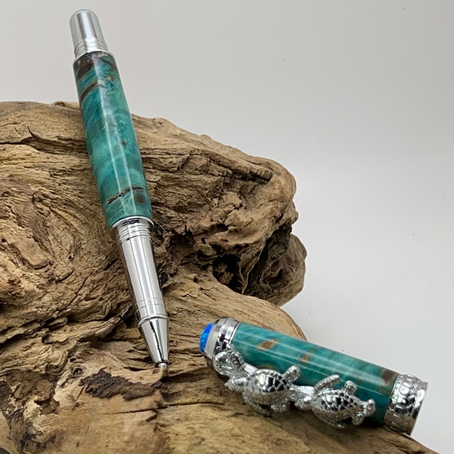 Handcrafted Box elder wood pen dyed turquoise with turtle cap