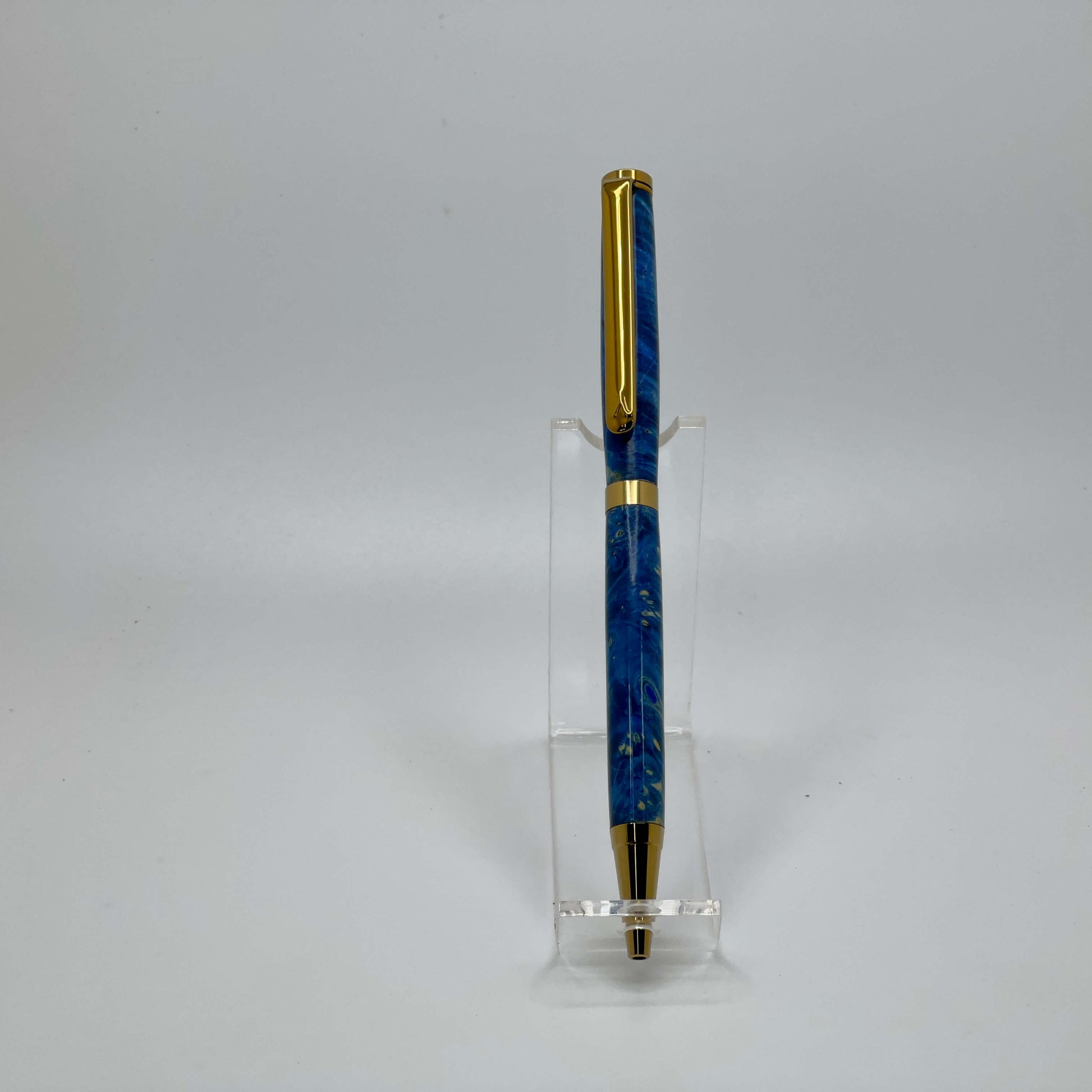 Front view of handcrafted pen with Box Elder Burl wood dyed blue