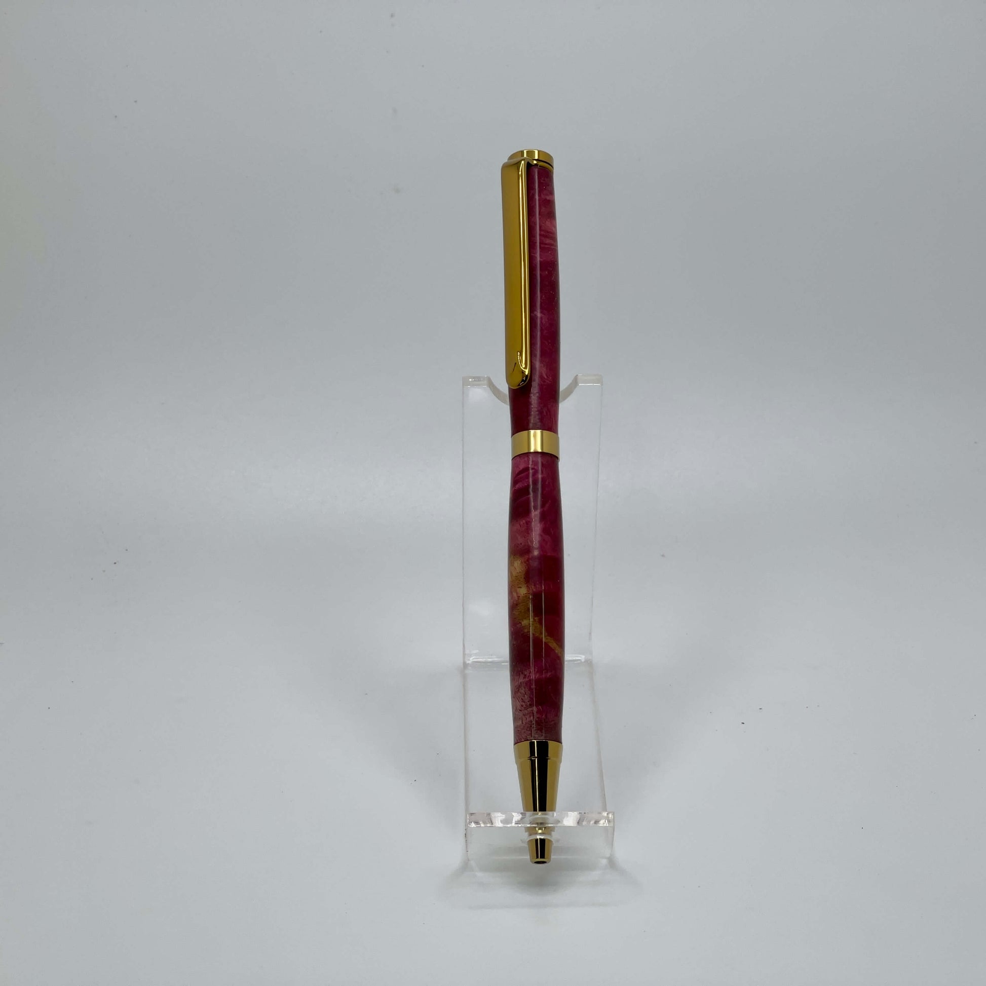 Front view of handcrafted pen with Box Elder Burl wood dyed magenta
