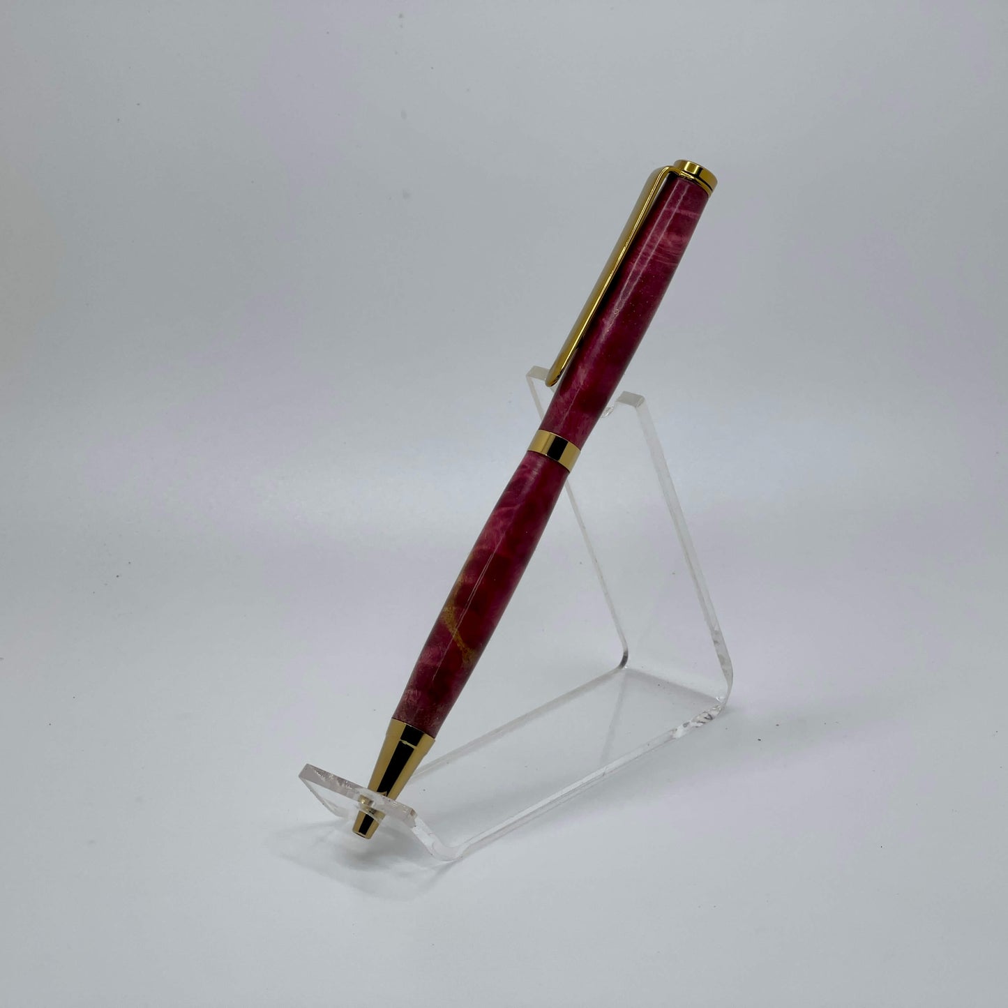 Right side view of handcrafted pen with Box Elder Burl wood dyed magenta